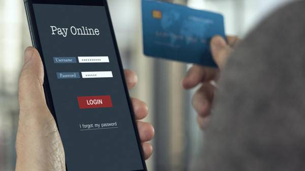 Image of holidaymaker booking tickets on smartphone