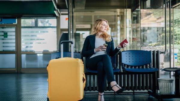 Image of woman sat at airport