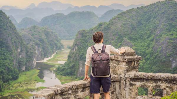 Image of traveller in mountainous landscape