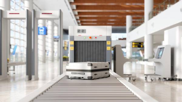 Image of baggage going through airport security