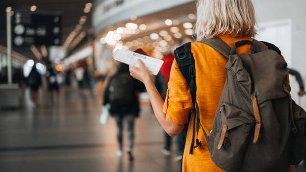 Woman at airport preparing for travel