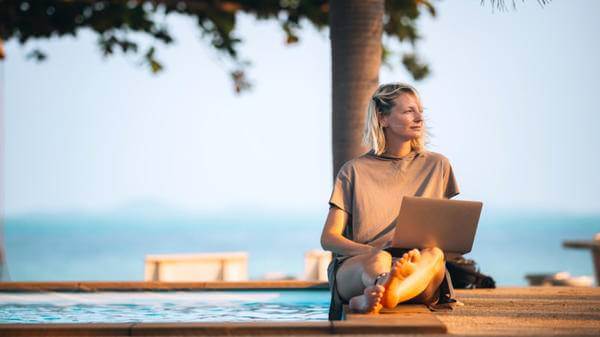 Image of woman in Thailand on her laptop