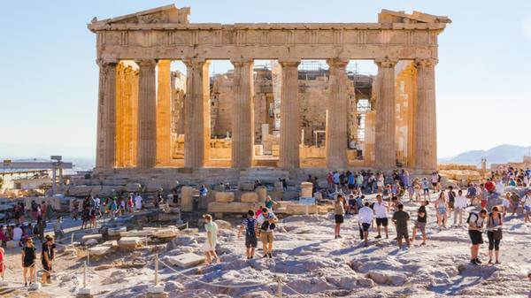 Crowds of tourists at the Parthenon in the Acropolis in Athens, Greece