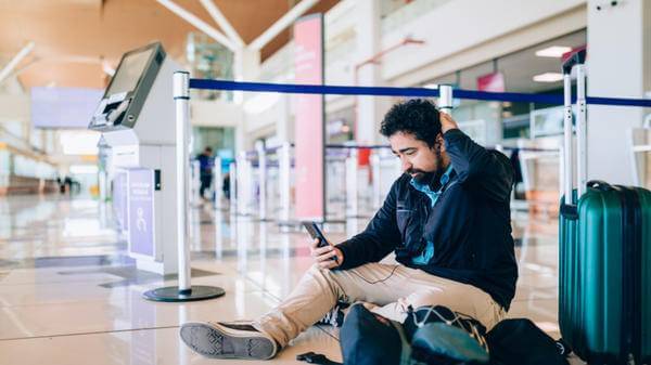 Man at airport worried about his flight 