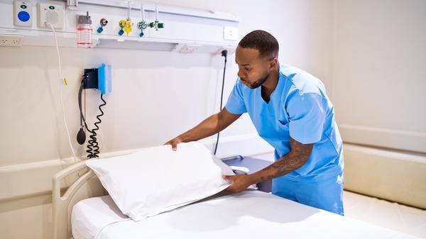 Hospital bed with nurse
