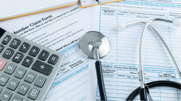 Image of hospital bills and a stethoscope