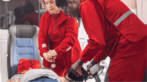 Image of medics treating a patient inside an air ambulance