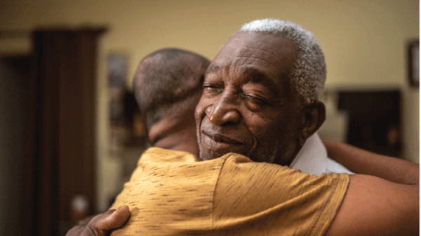 Man hugging family member