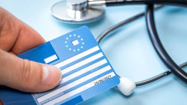 European health insurance card next to a medical stethoscope
