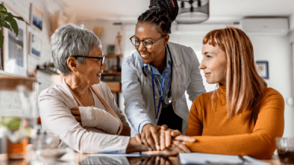 Doctor holding hands with patients