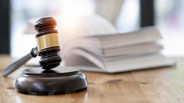 Wooden brown judge gavel on the table