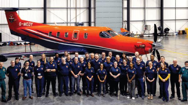 Skycare crew infront of a plane