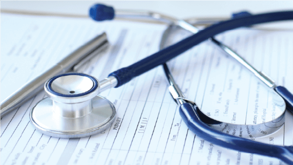 Stethoscope on a medical sheet