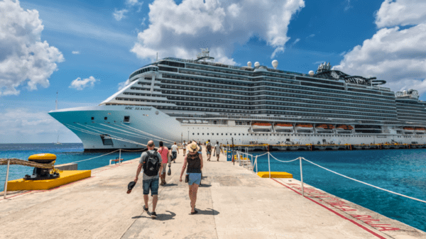 People walking up to a large cruise ship