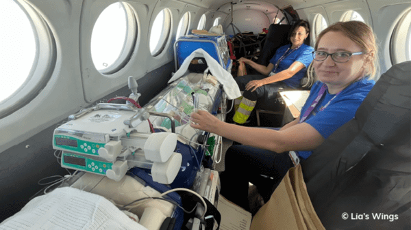 Nurses with patient in a plane