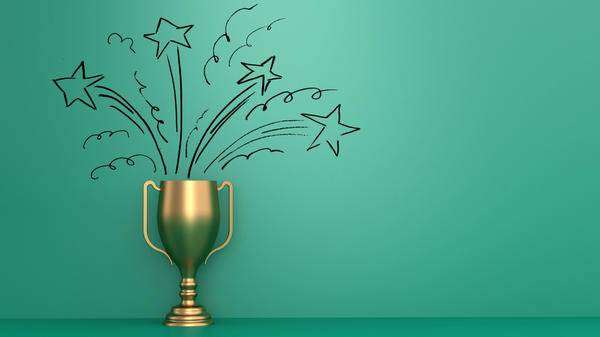 Gold trophy on green background