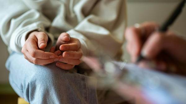 Close-up of therapy session with teenage girl 