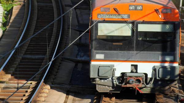 Railway, bridge, high angle view of commuter train. Barcelona, Catalonia, Spain
