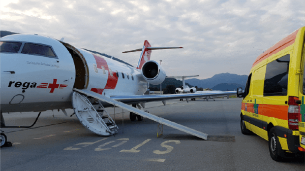 Air ambulance and ambulance on runway