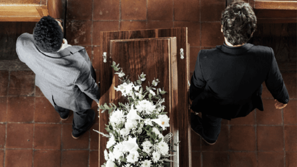 Funeral coffin being carried