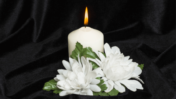 Funeral candle and flowers