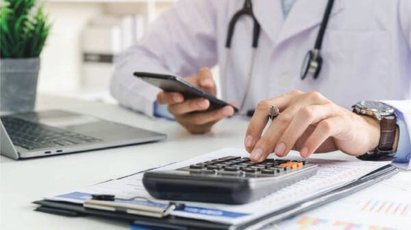 Doctor with calculator