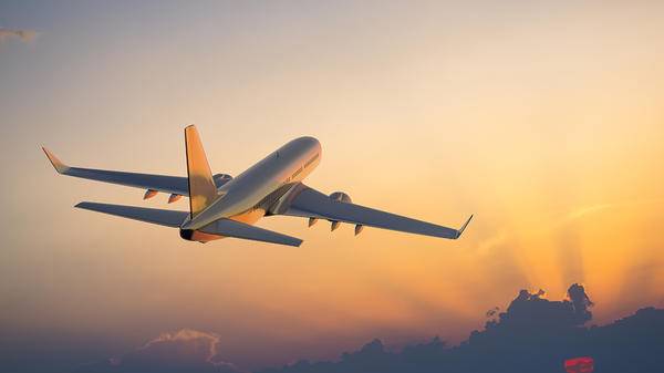 Plane over a sunset 