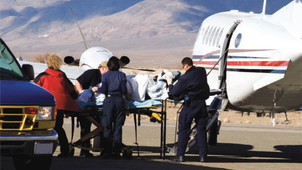 Patient carried into an air ambulance
