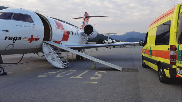 Air ambulance on a runway with an ambulance