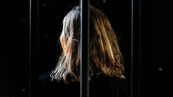 Woman behind bars