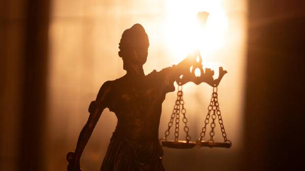 Statue of a woman holding scales 