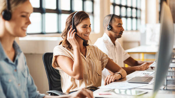 Woman taking a call at a call centre